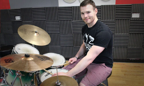 Duncan playing a drum kit