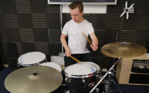 Richard playing drum kit