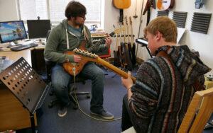 Conor and Michael playing the guitar