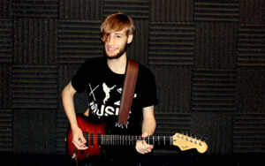 Seb playing the guitar