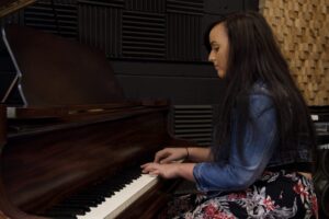 Zoë playing the piano