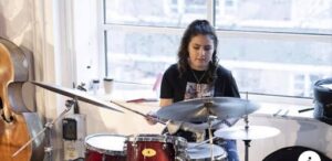 Georgia playing the drums