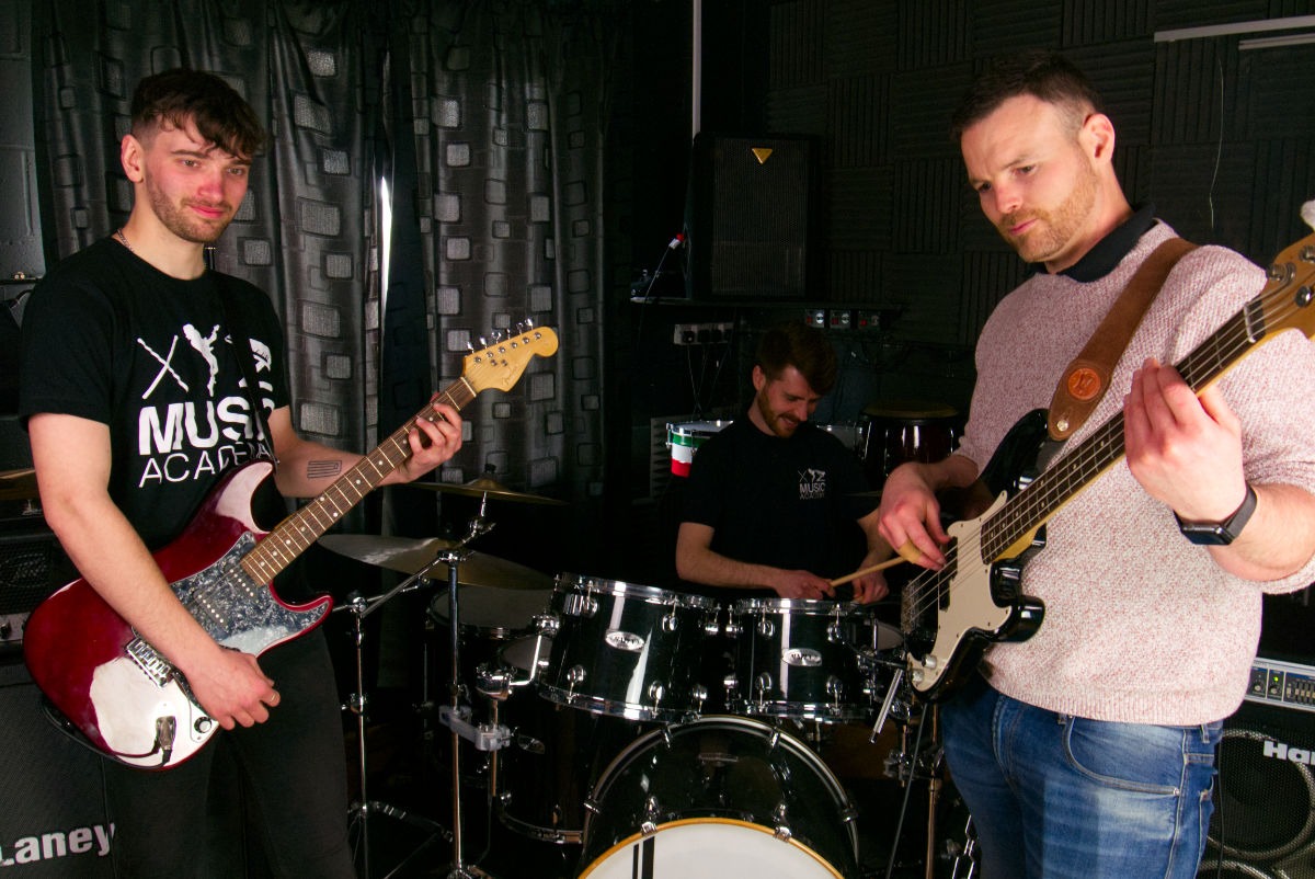 Tutors playing in a band