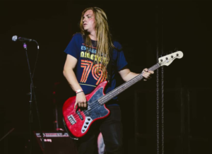 Casey playing the bass guitar