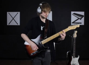 Seb playing the guitar