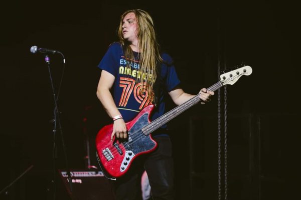 Casey playing the bass guitar